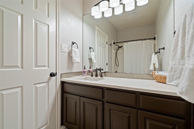 bathroom featuring vanity and a shower with curtain