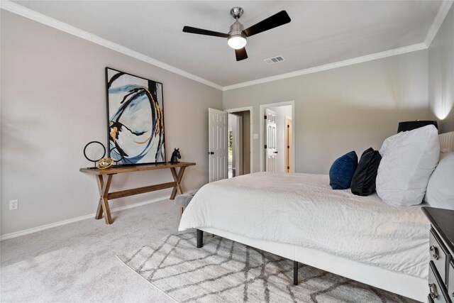 bedroom featuring ceiling fan, visible vents, crown molding, baseboards, and carpet flooring