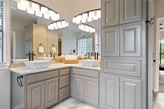 bathroom featuring double vanity and a sink