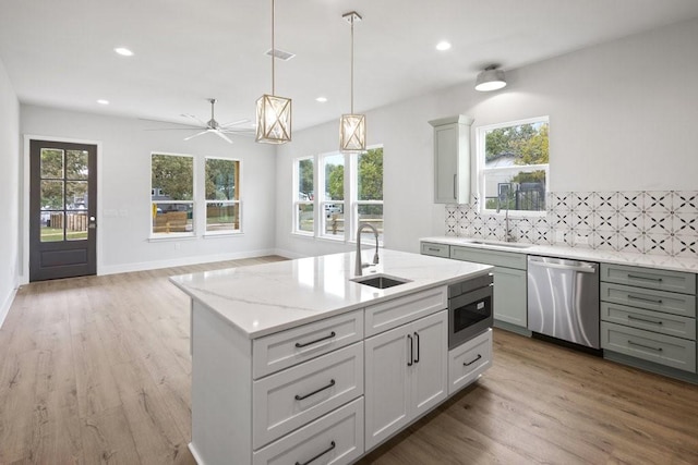 602 Shorewood Dr, Granite Shoals, TX 78654 - kitchen featuring a sink, a healthy amount of sunlight, and stainless steel appliances