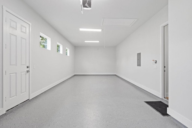 602 Shorewood Dr, Granite Shoals, TX 78654 - empty room featuring baseboards, speckled floor, attic access, and electric panel