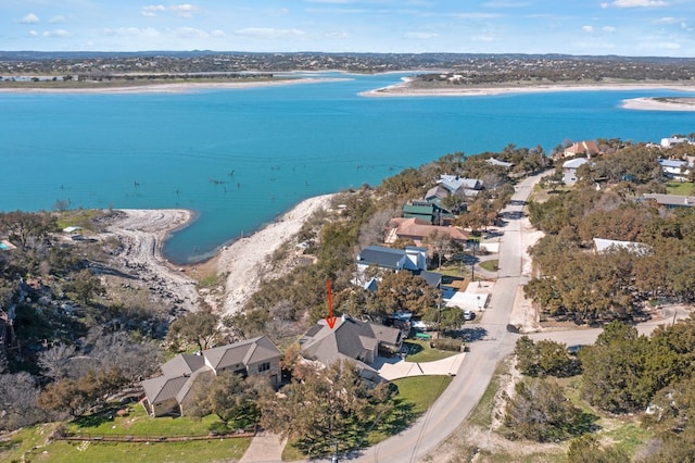 birds eye view of property with a residential view and a water view