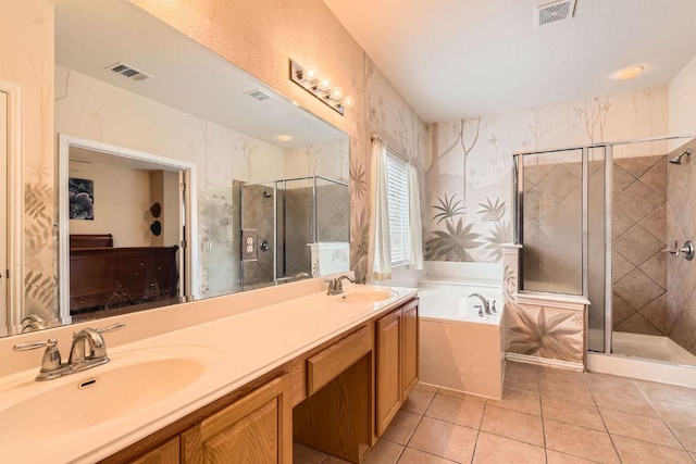 2420 Dakota Dunes Ct, Pflugerville, TX 78660 - full bath featuring a garden tub, a stall shower, tile patterned floors, double vanity, and wallpapered walls