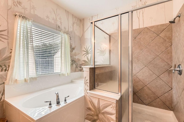full bath featuring a garden tub, a stall shower, and wallpapered walls
