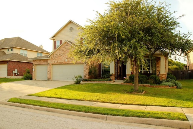 2420 Dakota Dunes Ct, Pflugerville, TX 78660 - view of front of home featuring brick siding, a garage, a front yard, and concrete driveway