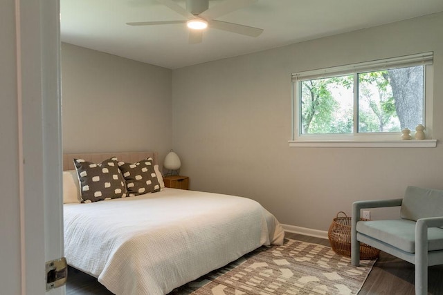 bedroom featuring a ceiling fan and baseboards
