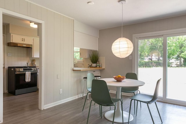 7515 Daugherty St, Austin, TX 78757 - dining space with healthy amount of natural light and dark wood-style flooring