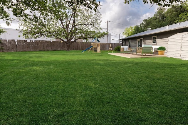 7515 Daugherty St, Austin, TX 78757 - view of yard featuring a playground and a patio