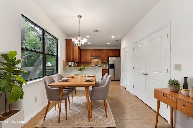 dining space with an inviting chandelier, recessed lighting, light tile patterned flooring, and visible vents