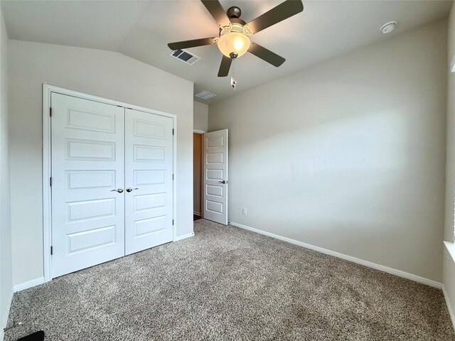 unfurnished bedroom with ceiling fan, carpet floors, baseboards, visible vents, and a closet