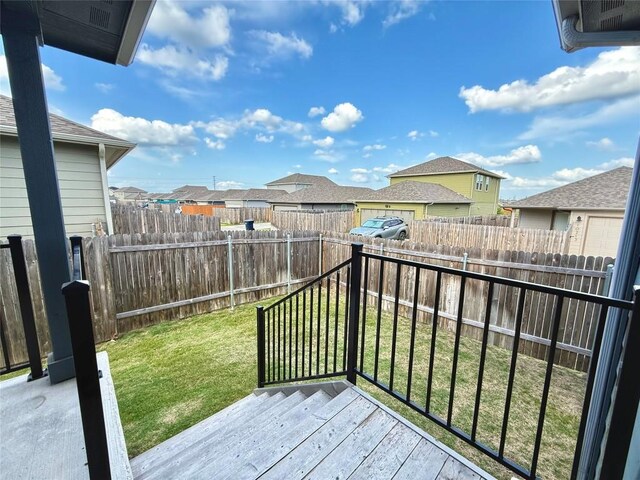 view of wooden balcony featuring a residential view and a wooden deck