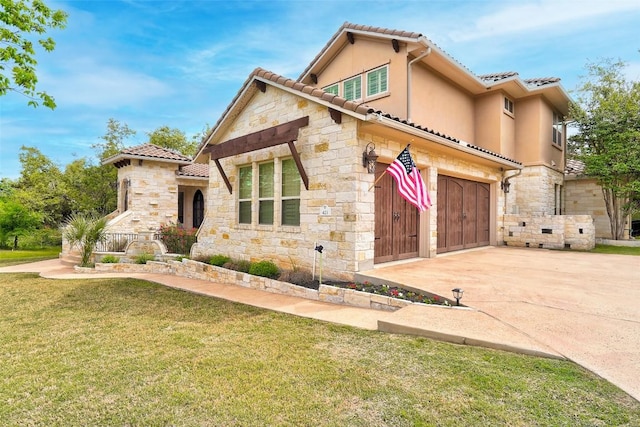 423 Bella Montagna Cir, Austin, TX 78734 - mediterranean / spanish-style home with stone siding, concrete driveway, a front lawn, and a tiled roof