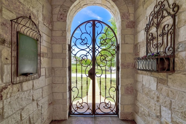 423 Bella Montagna Cir, Austin, TX 78734 - doorway with french doors, tile patterned floors, and plenty of natural light