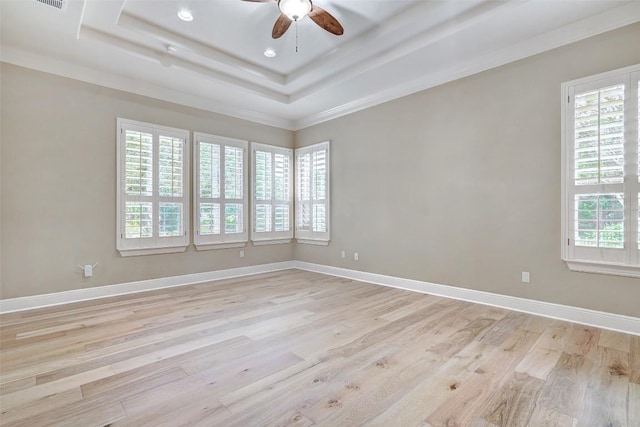 423 Bella Montagna Cir, Austin, TX 78734 - empty room with a ceiling fan, light wood-style flooring, recessed lighting, a raised ceiling, and ornamental molding