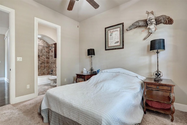 bedroom featuring baseboards, carpet flooring, connected bathroom, and ceiling fan