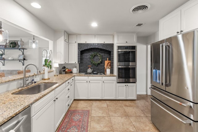 1418 Jackson Rd, Kerrville, TX 78028 - kitchen featuring a sink, white cabinets, stainless steel appliances, and visible vents