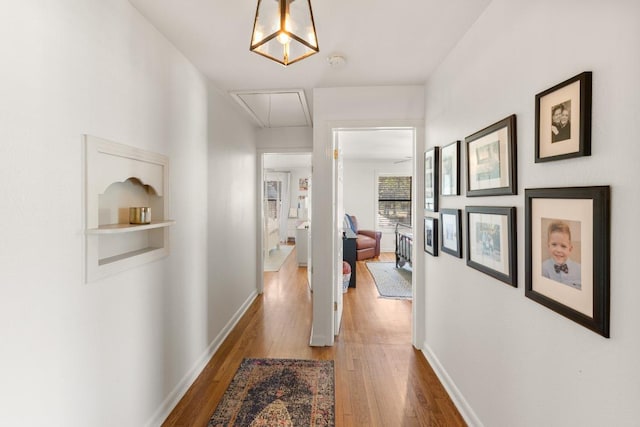 1418 Jackson Rd, Kerrville, TX 78028 - corridor with baseboards, attic access, and wood finished floors