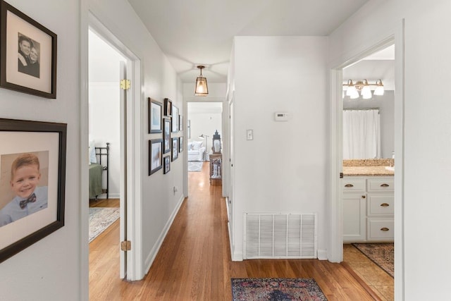 1418 Jackson Rd, Kerrville, TX 78028 - hall featuring baseboards, visible vents, and light wood-type flooring