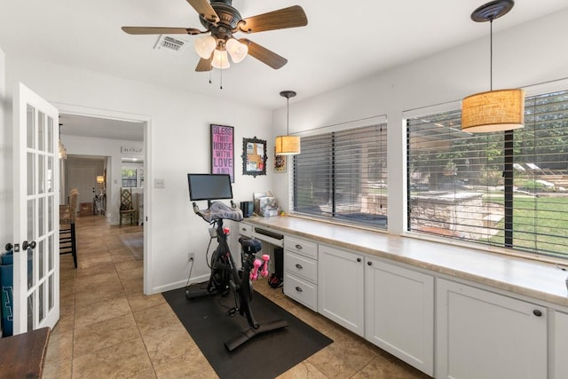 1418 Jackson Rd, Kerrville, TX 78028 - exercise room with visible vents, baseboards, ceiling fan, french doors, and light tile patterned floors