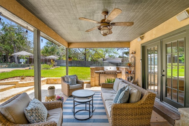 1418 Jackson Rd, Kerrville, TX 78028 - view of patio / terrace with grilling area, a fenced backyard, french doors, an outdoor kitchen, and an outdoor living space