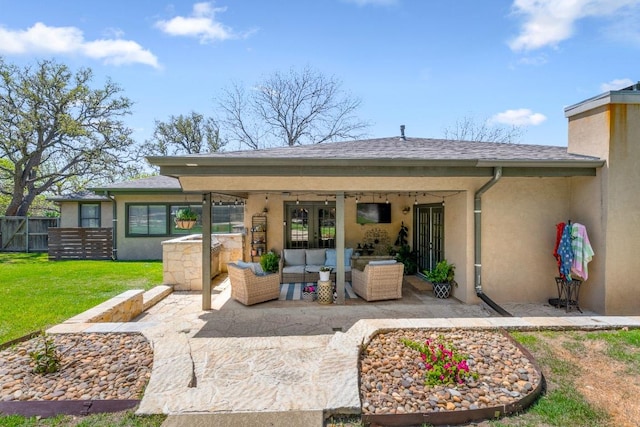 1418 Jackson Rd, Kerrville, TX 78028 - back of house featuring fence, stucco siding, an outdoor living space, a patio area, and a yard