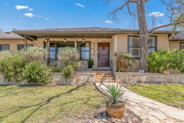 1418 Jackson Rd, Kerrville, TX 78028 - ranch-style house with stucco siding, stone siding, a front yard, and covered porch