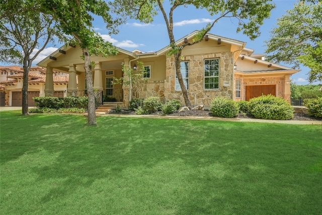 1916 Wimberly Ln, Austin, TX 78735 - view of front of home with a garage, stone siding, and a front yard