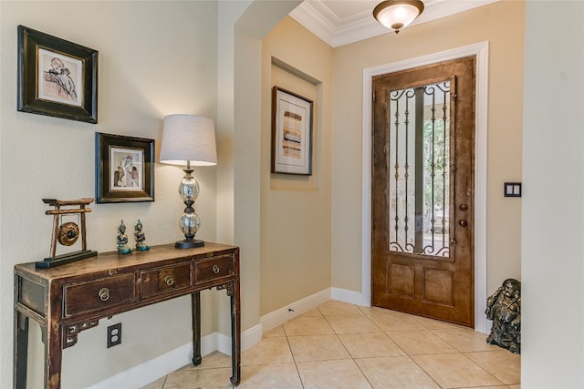 1916 Wimberly Ln, Austin, TX 78735 - entryway featuring crown molding, arched walkways, light tile patterned floors, and baseboards