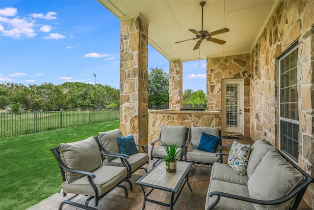 view of patio / terrace featuring an outdoor living space, a ceiling fan, and a fenced backyard
