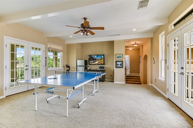 rec room with beamed ceiling, french doors, and visible vents