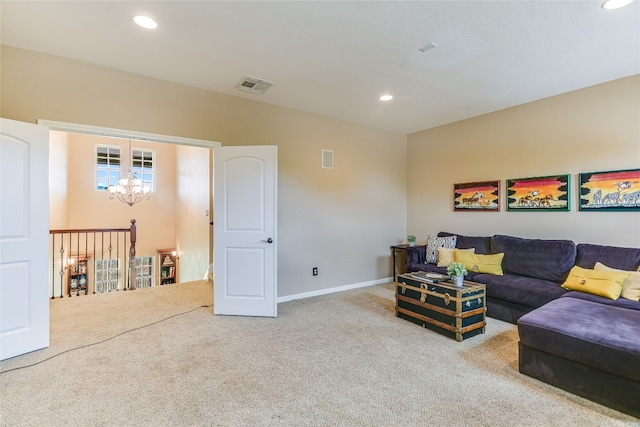living area featuring visible vents, an inviting chandelier, baseboards, recessed lighting, and carpet flooring