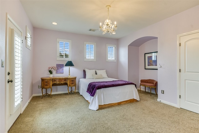 1916 Wimberly Ln, Austin, TX 78735 - carpeted bedroom featuring a chandelier, arched walkways, baseboards, and recessed lighting