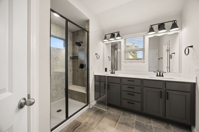 2813 Hopi Path Unit 11, Georgetown, TX 78628 - bathroom featuring double vanity, a sink, and a stall shower