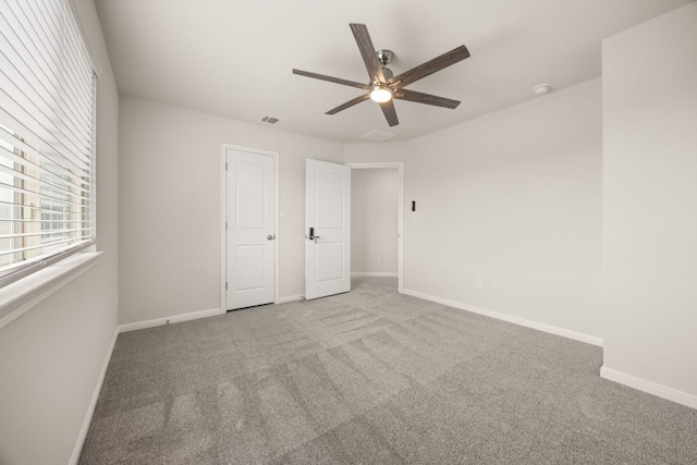 2813 Hopi Path Unit 11, Georgetown, TX 78628 - unfurnished bedroom with carpet floors, baseboards, and visible vents