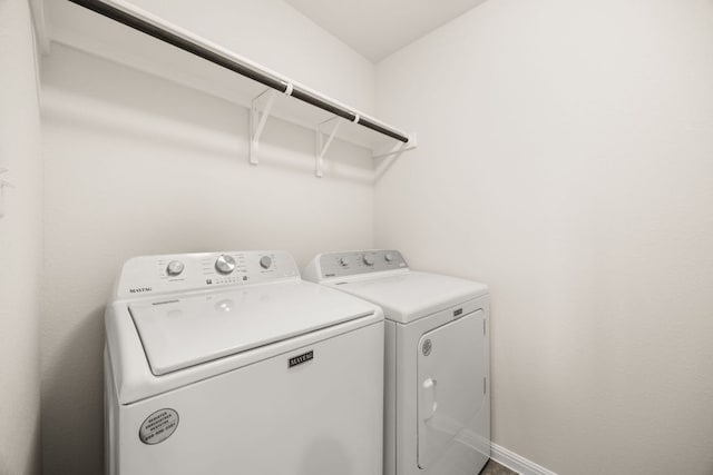 2813 Hopi Path Unit 11, Georgetown, TX 78628 - clothes washing area featuring separate washer and dryer and laundry area