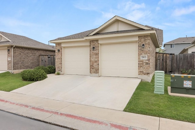 2813 Hopi Path Unit 11, Georgetown, TX 78628 - single story home with a front yard, brick siding, fence, concrete driveway, and an attached garage