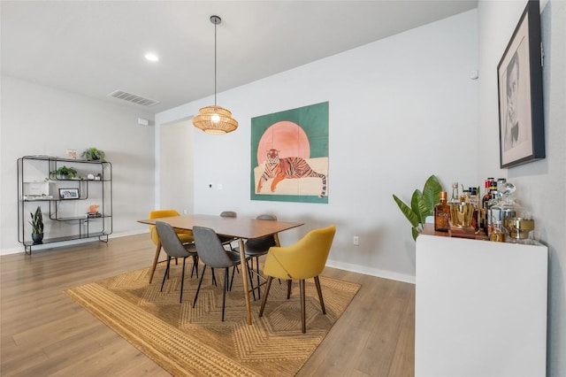 8600 Chrysler Bnd, Austin, TX 78744 - dining space with baseboards, recessed lighting, wood finished floors, and visible vents