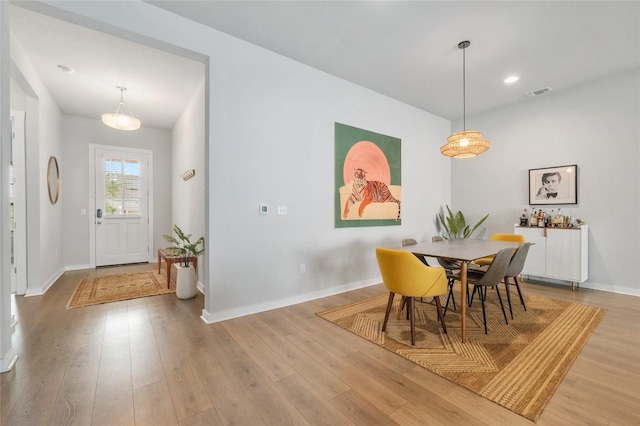 8600 Chrysler Bnd, Austin, TX 78744 - dining space with light wood finished floors, baseboards, and recessed lighting