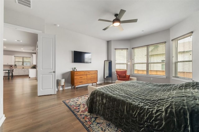 8600 Chrysler Bnd, Austin, TX 78744 - bedroom featuring ceiling fan, visible vents, wood finished floors, baseboards, and recessed lighting