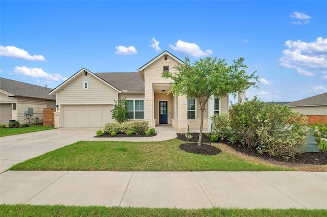 8600 Chrysler Bnd, Austin, TX 78744 - ranch-style house featuring an attached garage, concrete driveway, a front lawn, and stone siding