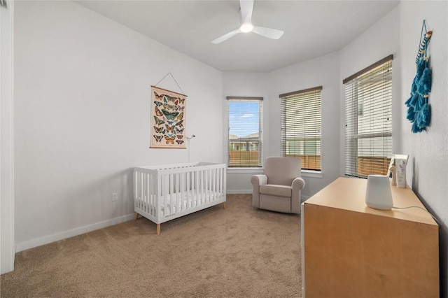 8600 Chrysler Bnd, Austin, TX 78744 - bedroom featuring carpet flooring, a nursery area, baseboards, and multiple windows
