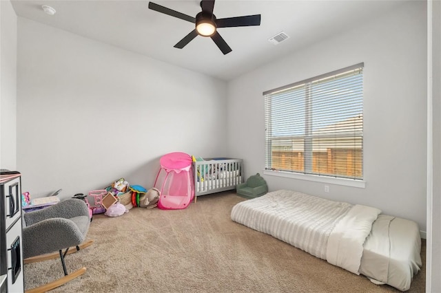8600 Chrysler Bnd, Austin, TX 78744 - carpeted bedroom with a ceiling fan