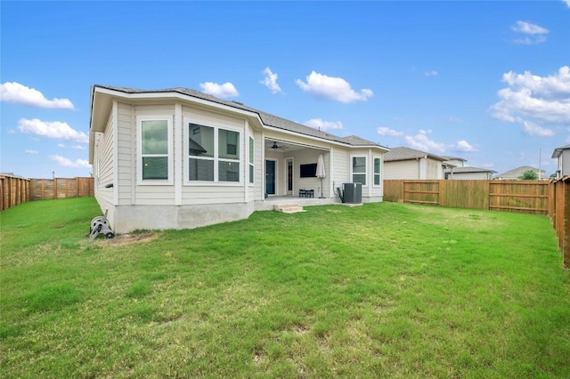 8600 Chrysler Bnd, Austin, TX 78744 - back of house featuring a fenced backyard, ceiling fan, and a patio area