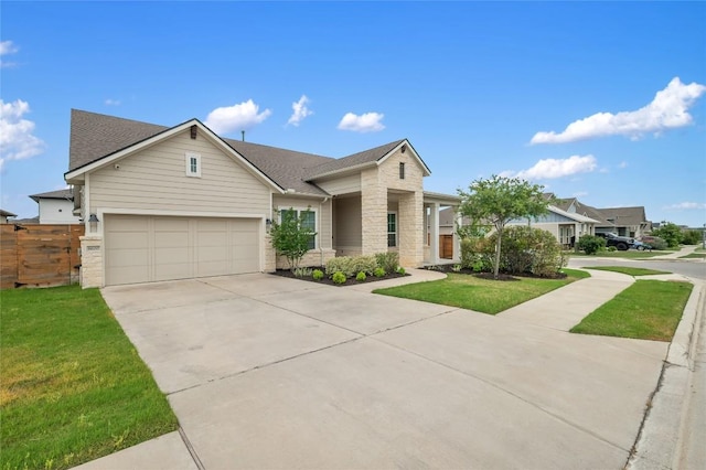 8600 Chrysler Bnd, Austin, TX 78744 - ranch-style house with concrete driveway, fence, stone siding, and a front lawn