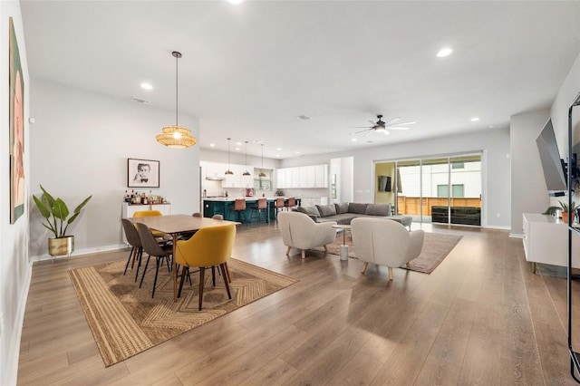 8600 Chrysler Bnd, Austin, TX 78744 - dining room featuring baseboards, recessed lighting, a ceiling fan, and light wood-style flooring