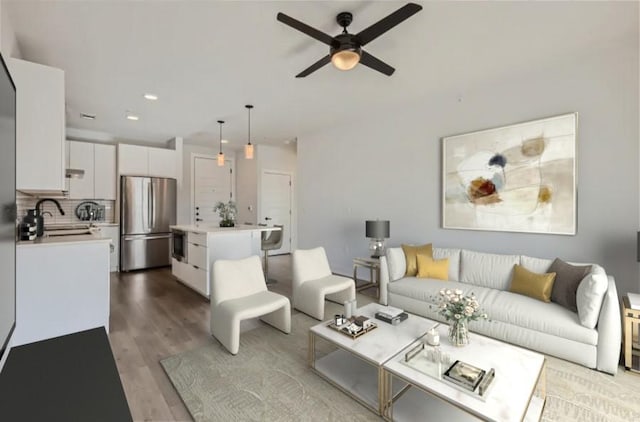 living room with recessed lighting, a ceiling fan, and wood finished floors