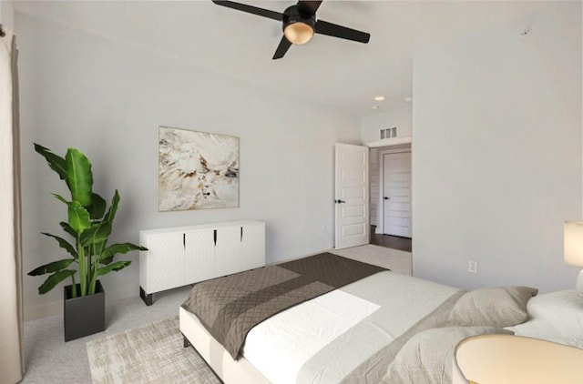 bedroom featuring ceiling fan, carpet flooring, and visible vents