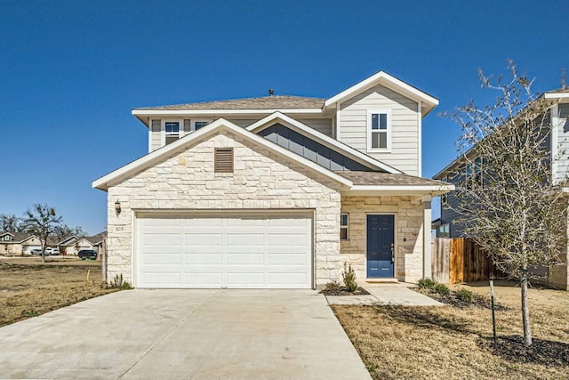 traditional home featuring fence, roof with shingles, an attached garage, stone siding, and concrete driveway