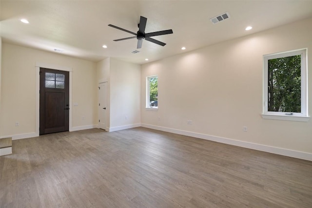 1000 Vargas Rd Unit A, Austin, TX 78741 - unfurnished living room with recessed lighting, wood finished floors, and a ceiling fan