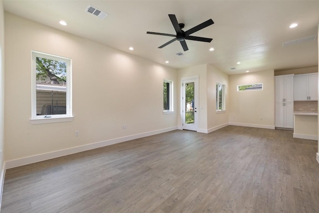 1000 Vargas Rd Unit A, Austin, TX 78741 - unfurnished living room featuring light wood-style floors, recessed lighting, and a ceiling fan
